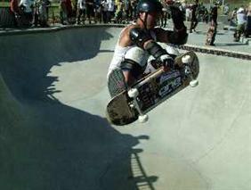 Boy getting lot of air off pool side